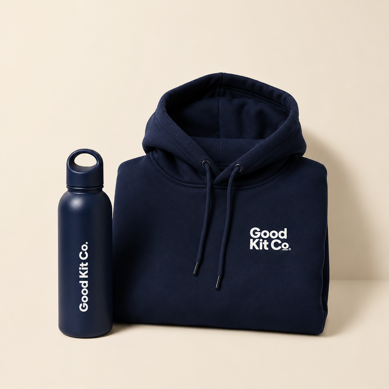 Good Kit Starter Pack — Folded navy branded hoodie next to a matching navy bottle